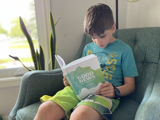 Child reading a Kaleidoscope Kids Bible